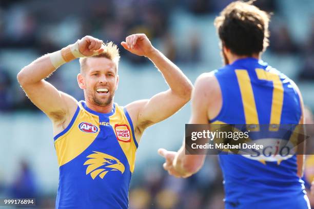 Mark LeCras of the Eagles celebrates a goal by Josh Kennedy of the Eagles during the round 17 AFL match between the Collingwood Magpies and the West...