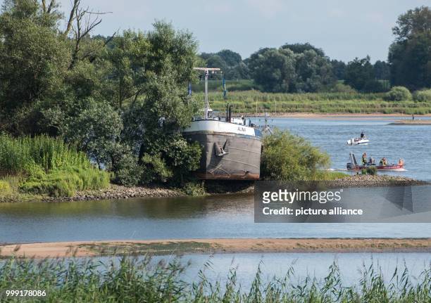 The tanker Alina lies stranded on a bank after running aground near Hamburg, Germany, 16 August 2017. The ship's crew and tanks escaped the incident...