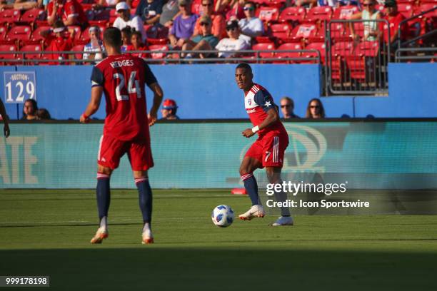 Dallas midfielder Carlos Gruezo passes the ball to FC Dallas defender Matt Hedges during the game between FC Dallas and Chicago Fire on July 14 at...