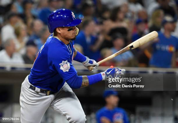 Javier Baez of the Chicago Cubs hits an RBI double during the fifth inning of a baseball game against the San Diego Padres at PETCO Park on July 14,...