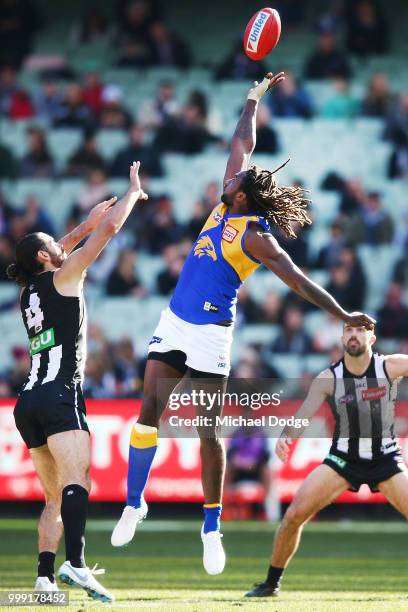 Nic Naitanui of the Eagles competes for the ball against Brodie Grundy of the Magpies during the round 17 AFL match between the Collingwood Magpies...