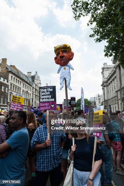 Protesters hold an effigy of the US president Donald Trump as hundreds of anti-fascist and anti-racism activists stage a counter demonstratiion to...