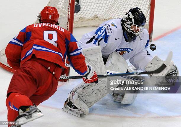 Russia's Alexander Ovechkin of NHL's Washington Capitals attacks Finland's goalie Petri Vehanen during a qualification round match of the IIHF...