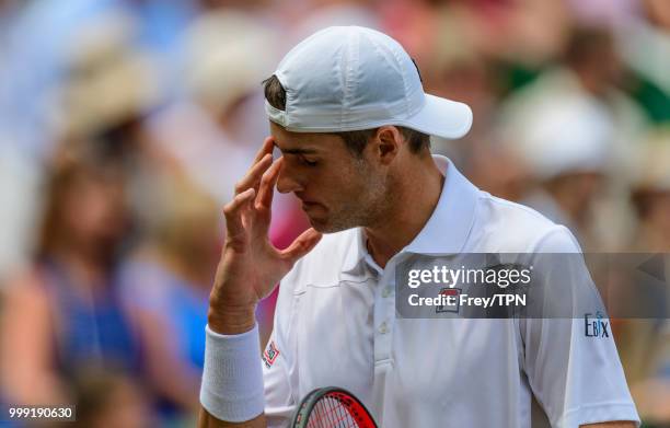 John Isner of the United States looks dejected against Kevin Anderson of South Africa in the semi final of the gentlemen's singles at the All England...