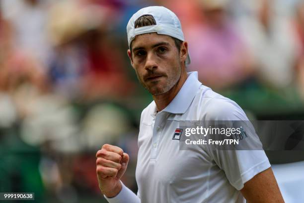 John Isner of the United States celebrates against Kevin Anderson of South Africa in the semi final of the gentlemen's singles at the All England...