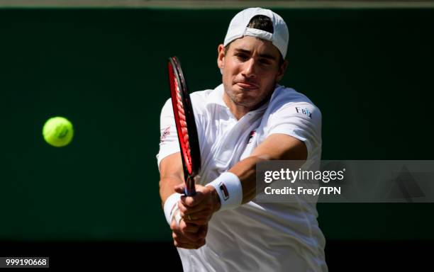 John Isner of the United States in action against Kevin Anderson of South Africa in the semi final of the gentlemen's singles at the All England Lawn...