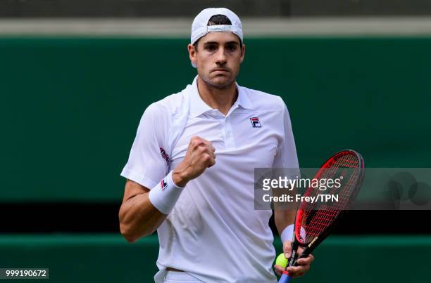 John Isner of the United States in action against Kevin Anderson of South Africa in the semi final of the gentlemen's singles at the All England Lawn...