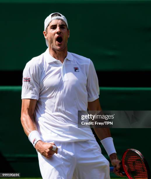 John Isner of the United States celebrates against Kevin Anderson of South Africa in the semi final of the gentlemen's singles at the All England...