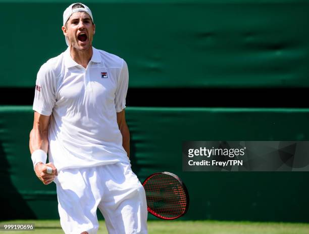 John Isner of the United States celebrates against Kevin Anderson of South Africa in the semi final of the gentlemen's singles at the All England...