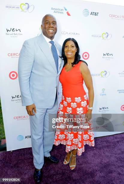 Magic Johnson and Cookie Johnson attend the HollyRod 20th Annual DesignCare at Cross Creek Farm on July 14, 2018 in Malibu, California.