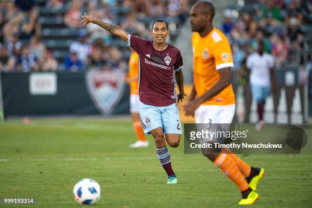 Edgar Castillo of Colorado Rapids gestures to teammates against the Houston Dynamo at Dick's Sporting Goods Park on July 14, 2018 in Commerce City,...