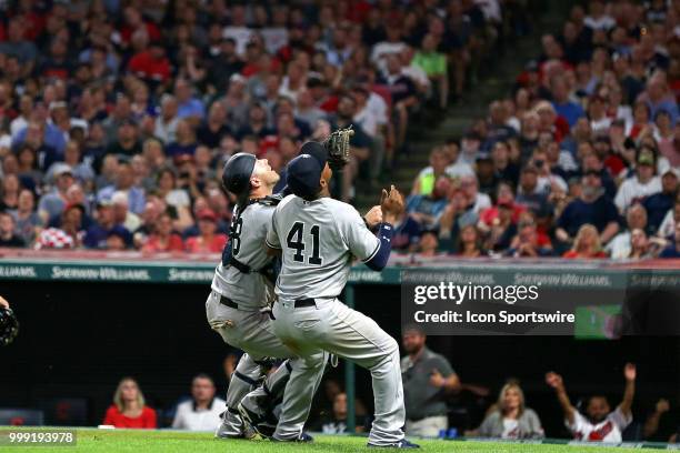 New York Yankees catcher Austin Romine and New York Yankees third baseman Miguel Andujar collide as they both make a play on a foul ball behind home...