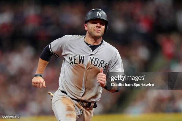 New York Yankees catcher Austin Romine advances to third base on a single by New York Yankees second baseman Tyler Wade during the ninth inning of...