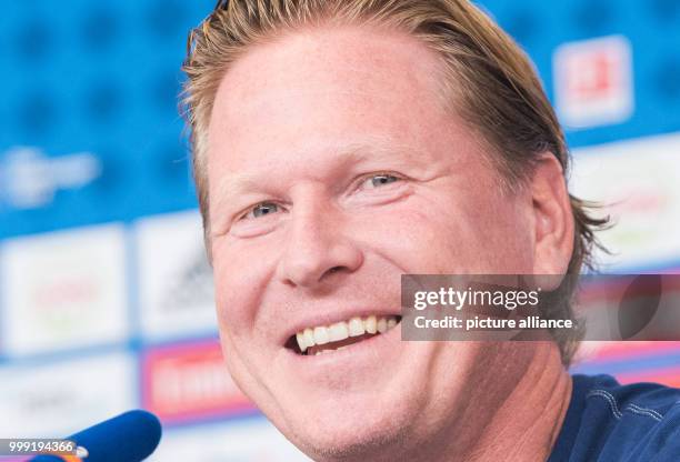 Markus Gisdol, coach of the soccer club Hamburger SV is speaking at a press conference ahead of the start of the new bundesliga season in Hamburg,...