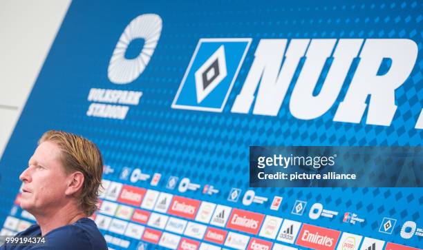 Markus Gisdol, coach of the soccer club Hamburger SV is speaking at a press conference ahead of the start of the new bundesliga season in Hamburg,...