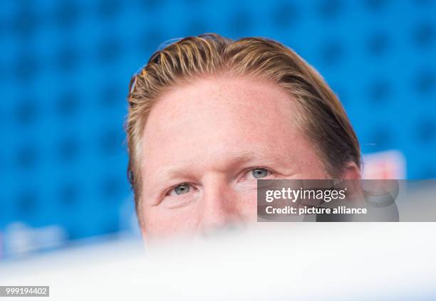 Markus Gisdol, coach of the soccer club Hamburger SV is speaking at a press conference ahead of the start of the new bundesliga season in Hamburg,...