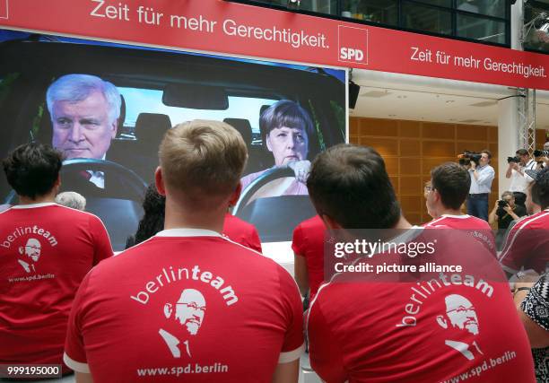 Photo of German Chancellor Angela Merkel and CSU leader Horst Seehofer is displayed during a presentation for the SPD election campaign at...
