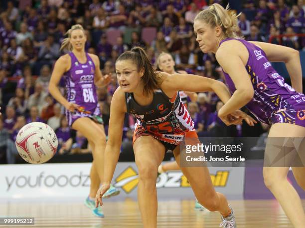 Susan Pettitt of the Giants competes with Kimberley Jenner of the Firebirds during the round 11 Super Netball match between the Firebirds and the...