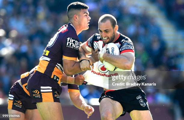 Simon Mannering of the Warriors takes on the defence during the round 18 NRL match between the Brisbane Broncos and the New Zealand Warriors at...