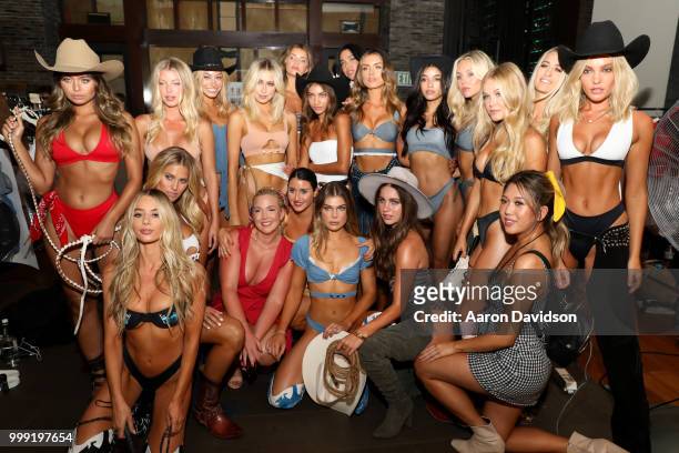 Models pose backstage for Kaohs during the Paraiso Fashion Fair at The Setai Miami Beach on July 14, 2018 in Miami Beach, Florida.