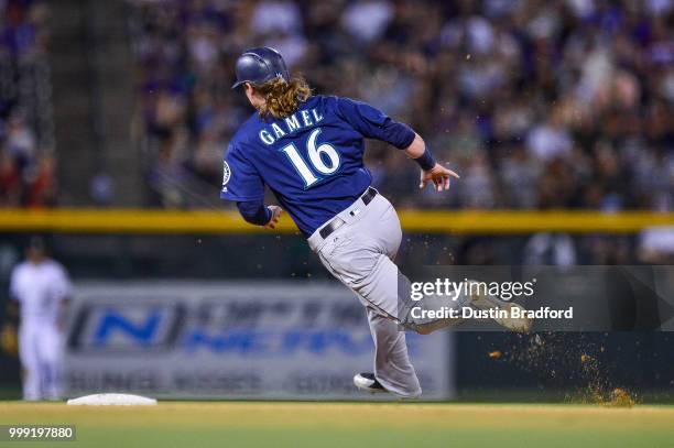 Ben Gamel of the Seattle Mariners rounds second base on his way to scoring from first base on a double by Chris Herrmann at Coors Field on July 14,...