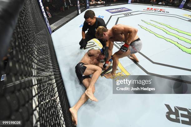 Sage Northcutt punches Zak Ottow in their welterweight fight during the UFC Fight Night event inside CenturyLink Arena on July 14, 2018 in Boise,...