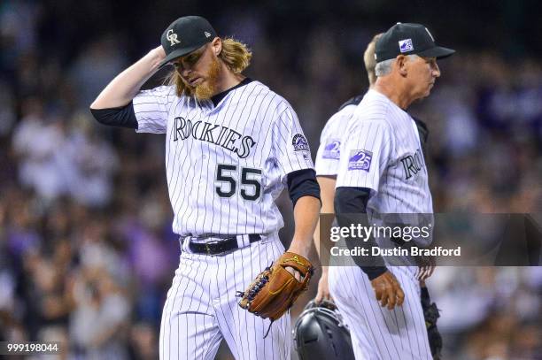 Jon Gray of the Colorado Rockies reacts after being relieved by manager Bud Black in the eighth inning of a game against the Seattle Mariners at...