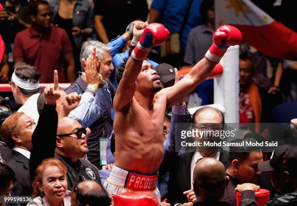 Philippine's Manny Pacquiao celebrated after winning fight with Argentina's Lucas Matthysse during their World welterweight boxing championship title...