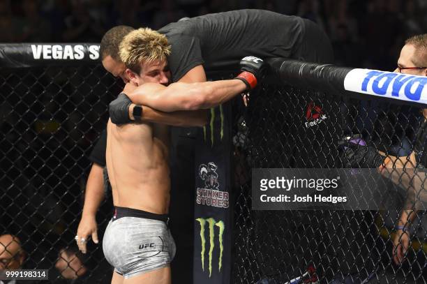 Sage Northcutt reacts with his corner after defeating Zak Ottow by TKO in their welterweight fight during the UFC Fight Night event inside...