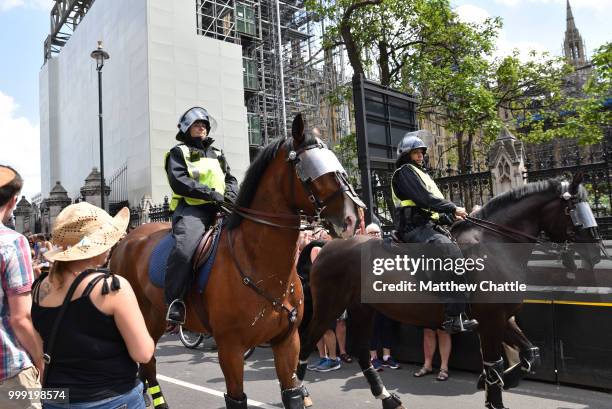 Anti fascists demonstrate against the Free Tommy Robinson event on Whitehall, police officers keep the groups apart.