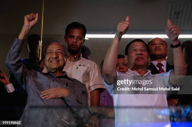 President of the Philippines Rodrigo Duterte with Malaysia's prime minister Mahathir Mohamed show thumbs up to Philippine's Manny Pacquiao after...