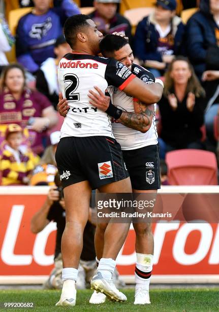Gerard Beale of the Warriors celebrates with David Fusitua after scoring a try during the round 18 NRL match between the Brisbane Broncos and the New...