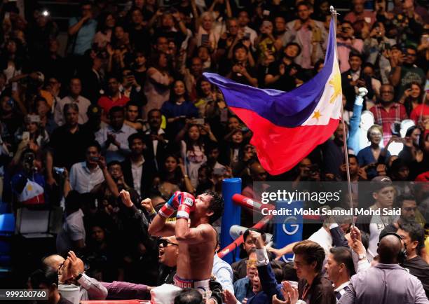 Philippine's Manny Pacquiao celebrated after winning fight with Argentina's Lucas Matthysse during their World welterweight boxing championship title...