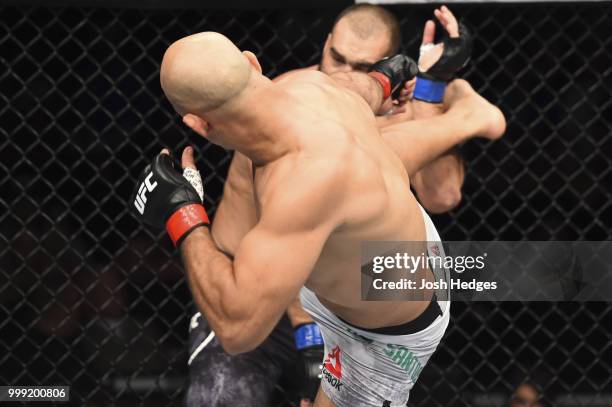 Junior Dos Santos of Brazil kicks Blagoy Ivanov in their heavyweight fight during the UFC Fight Night event inside CenturyLink Arena on July 14, 2018...