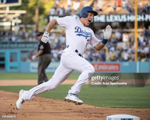 Los Angeles Dodgers' Chase Utley hustles around third base during a MLB game between the Los Angeles Angels of Anaheim and the Los Angeles Dodgers on...