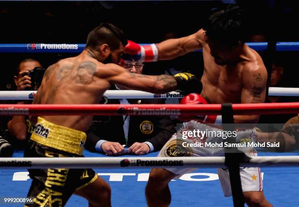 Argentina's Lucas Matthysse fight with Philippine's Manny Pacquiao during their World welterweight boxing championship title bout in Kuala Lumpur,...