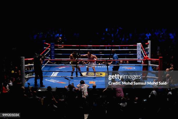 Philippine's Manny Pacquiao fight with Argentina's Lucas Matthysse during their World welterweight boxing championship title bout in Kuala Lumpur,...