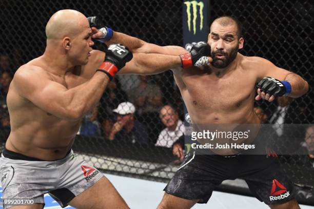 Junior Dos Santos of Brazil punches Blagoy Ivanov in their heavyweight fight during the UFC Fight Night event inside CenturyLink Arena on July 14,...