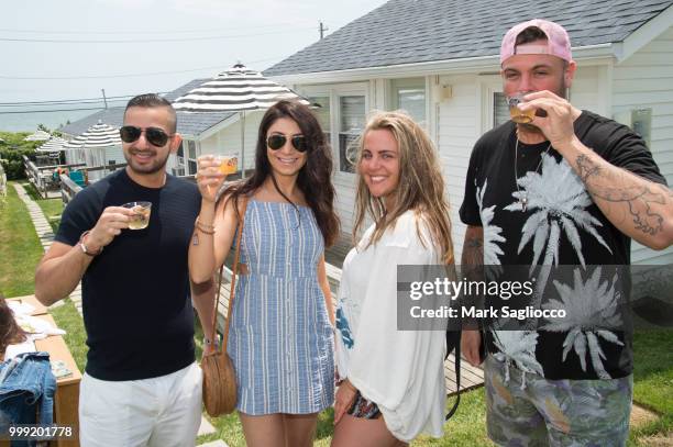 Chopra, Gigi Stepanyan, Michelle Dutton and Donny Donnowitz attend the Modern Luxury + The Next Wave at Breakers Montauk on July 14, 2018 in Montauk,...