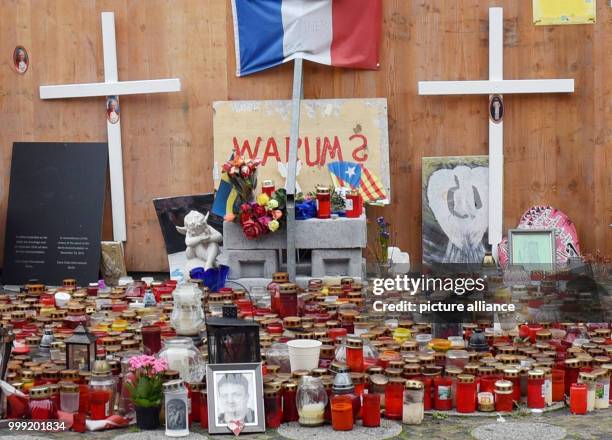 Candles and crosses pictured in front of the memorial for the victims of the terror attack on the Breitscheidplatz in Berlin, Germany, 18 August...