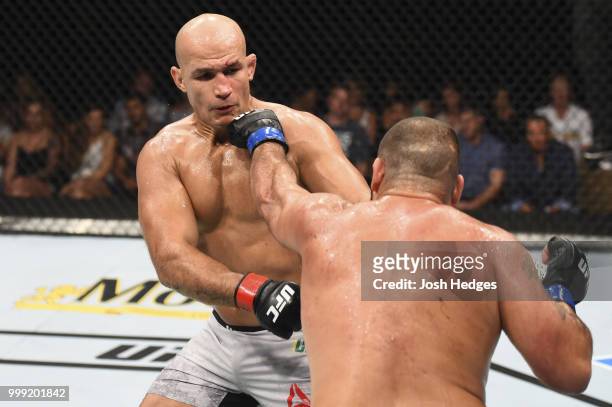 Blagoy Ivanov punches Junior Dos Santos of Brazil in their heavyweight fight during the UFC Fight Night event inside CenturyLink Arena on July 14,...