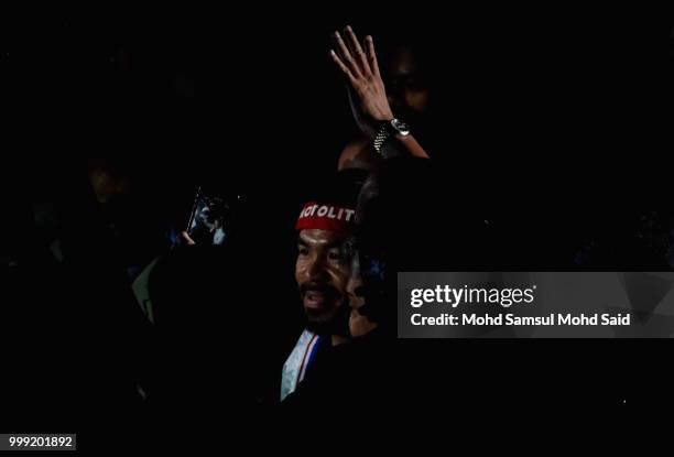 Philippine's Manny Pacquiao arrive at stage for their fight with Argentina's Lucas Matthysse during their World welterweight boxing championship...