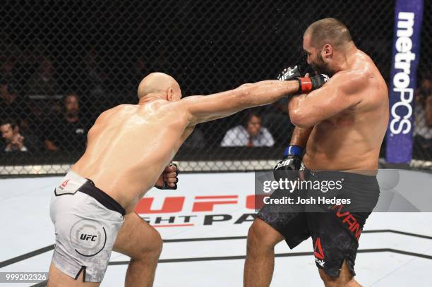 Junior Dos Santos of Brazil punches Blagoy Ivanov in their heavyweight fight during the UFC Fight Night event inside CenturyLink Arena on July 14,...