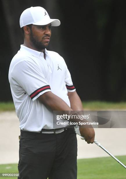 Harold Varner III watches his ball after taking his second shot on the hole during the third round of the John Deere Classic on July 14 at TPC Deere...