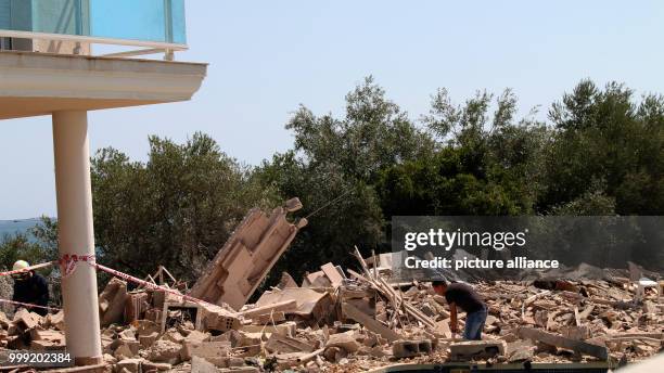 Ruins lie in front of a balcony after a neighbouring house exploded in Alcanar, Spain, 17 August 2017. The incident in the small town is connected to...