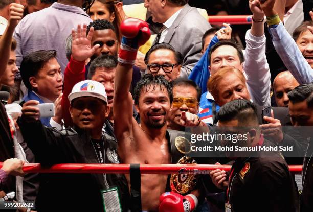 Philippine's Manny Pacquiao celebrated after winning fight with Argentina's Lucas Matthysse during their World welterweight boxing championship title...