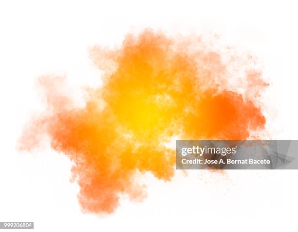 full frame of forms and textures of an explosion of powder and smoke of color yellow and orange on a white background. - bernat photos et images de collection