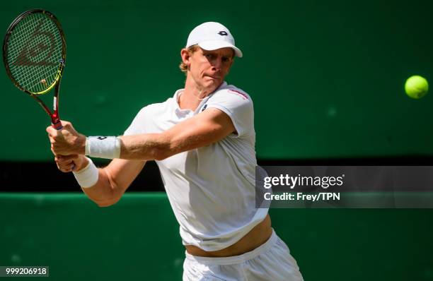 Kevin Anderson of South Africa in action against John Isner of the United States in the semi final of the gentlemen's singles at the All England Lawn...