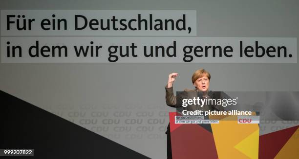 The German Chancellor Angela Merkel speaks underneath the lettering 'Fuer ein Deutschland, in dem wir gut und gerne leben' in Steinhude, Germany, 18...