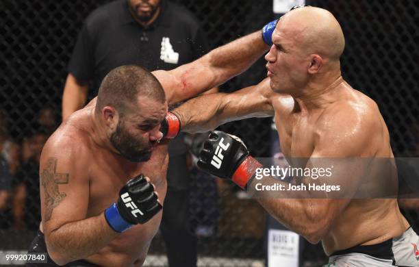 Junior Dos Santos of Brazil punches Blagoy Ivanov in their heavyweight fight during the UFC Fight Night event inside CenturyLink Arena on July 14,...